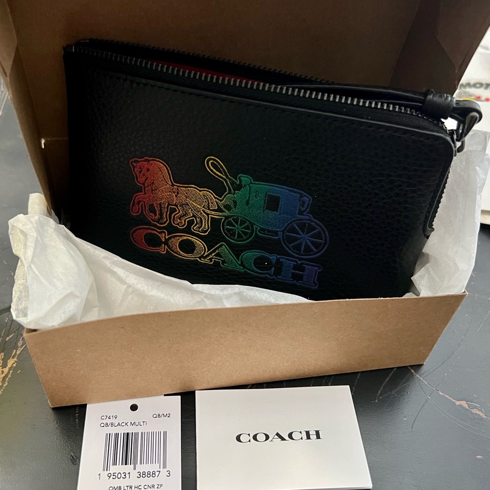 NWT BRAND NEW IN BOX WITH TAGS, BLK MULTI COLIR “COACH” WRISTLET. HARD TO FIND.